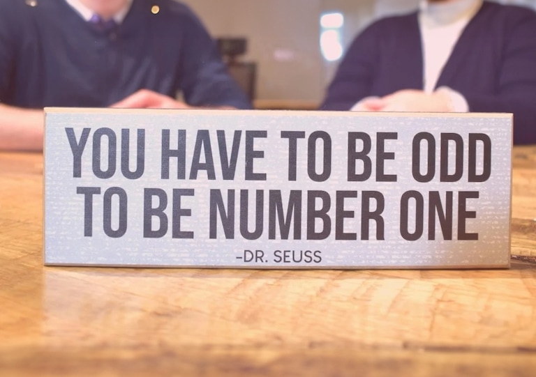 A sign with a Dr. Seuss quote that says "You have to be odd to be number one."